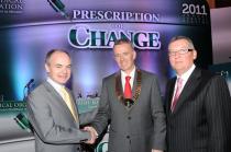 Prof Seán Tierney congratulates Dr Ronan Boland